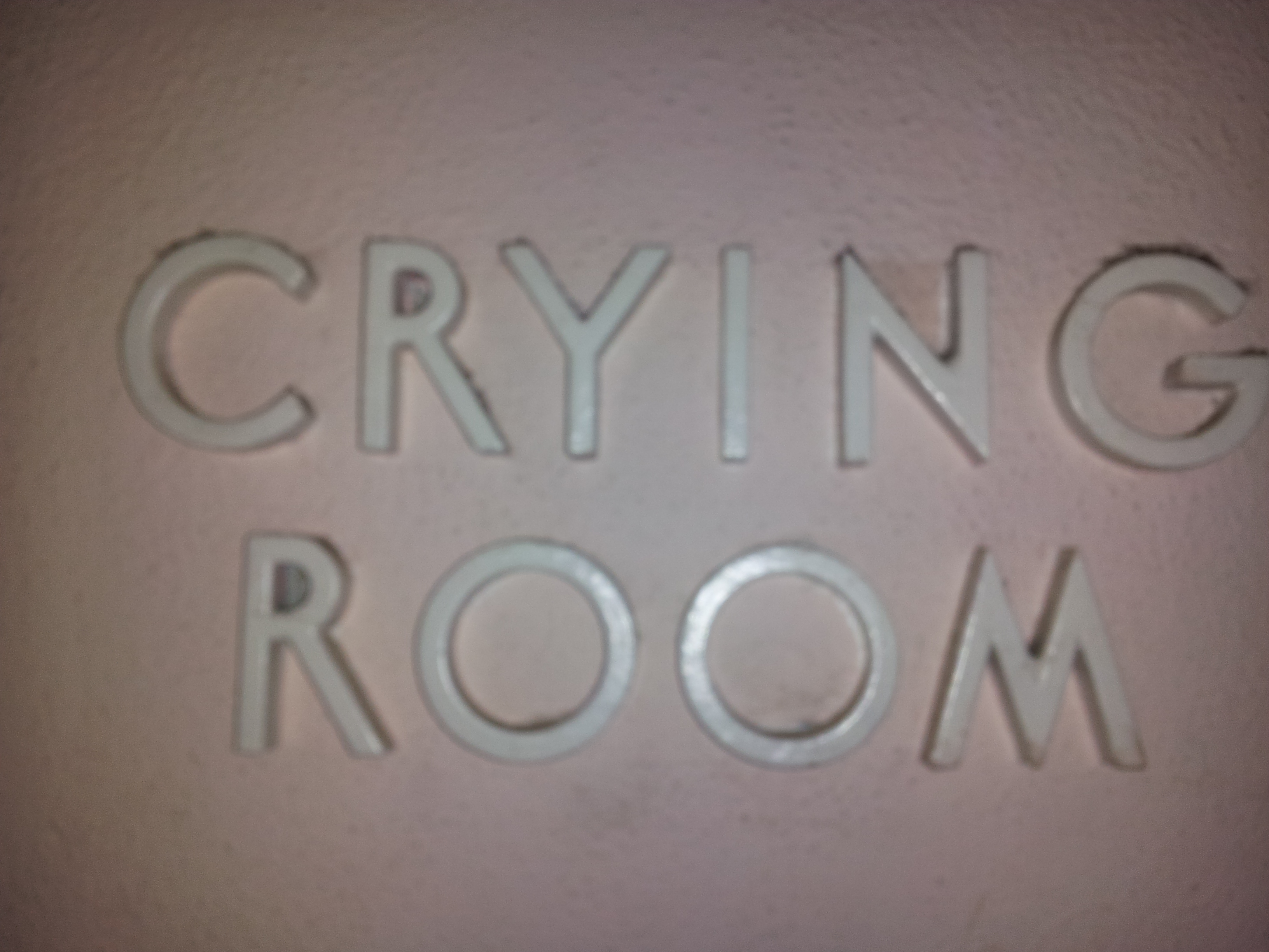White letters reading "crying room"