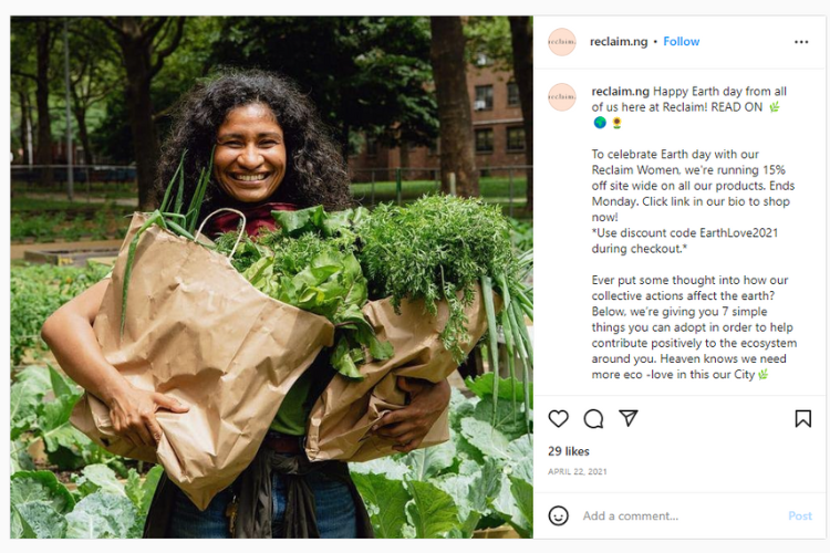 Screenshot of Instagram post of woman in garden holding brown bags filled with vegetables.