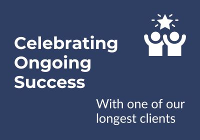 Blue background with white text reading "celebrating ongoing success with one of our longest clients" and a graphic of people around a globe.