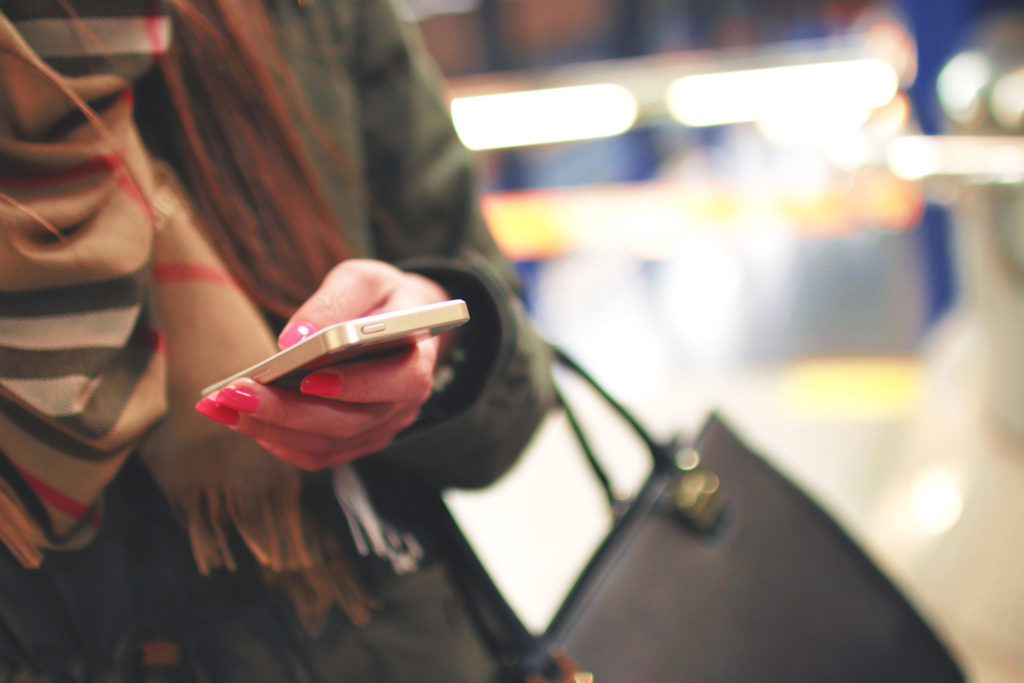 Image of hand holding phone