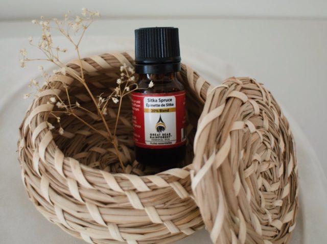 Essential oils bottle sitting in a wicker basket