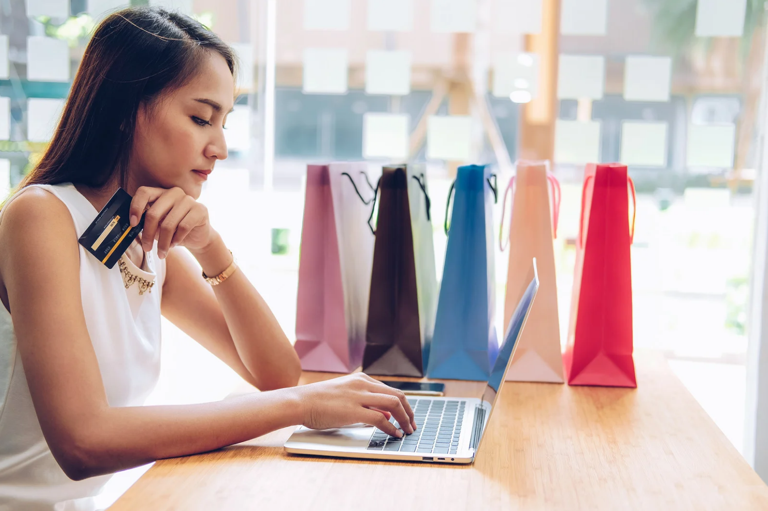 Woman online shopping on laptop